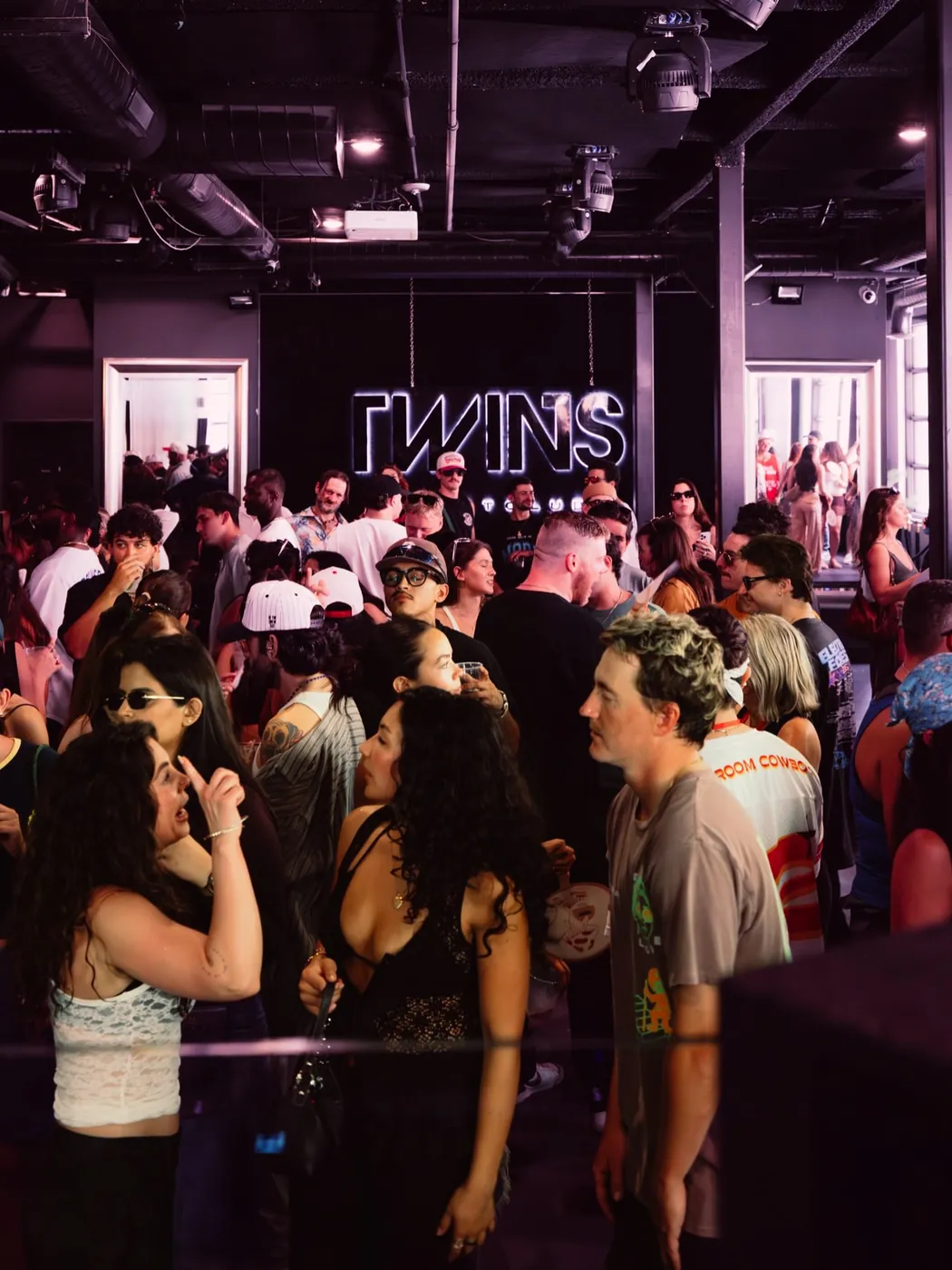 Crowd surrounding the TWINS DJ booth