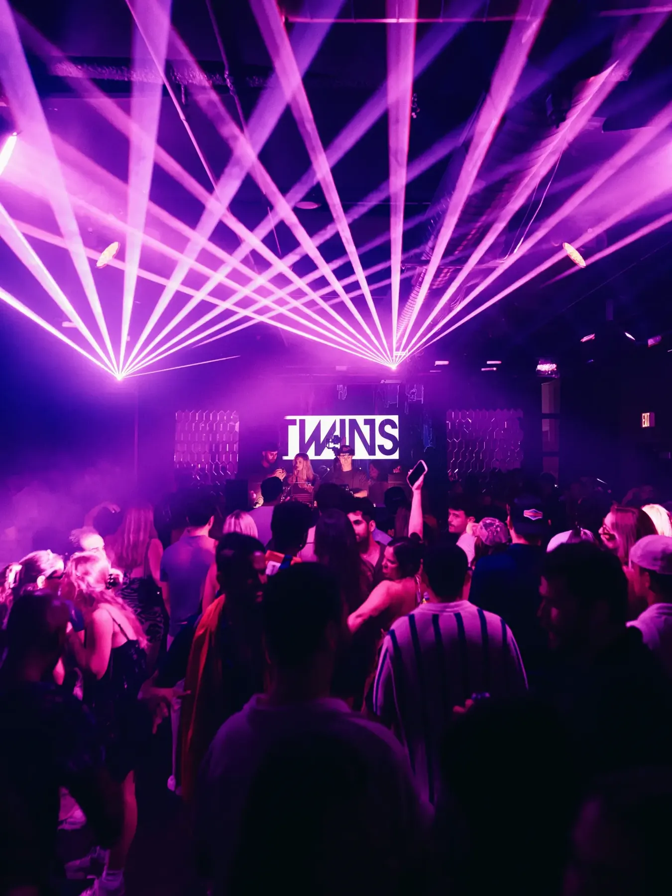 TWINS Nightclub dance floor under violet lasers